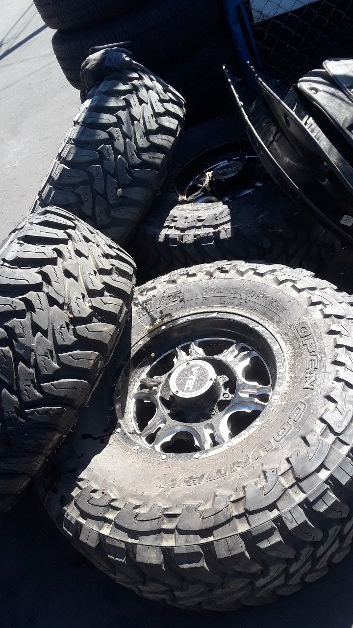 Mud-terrain tires on a polished off-road rim