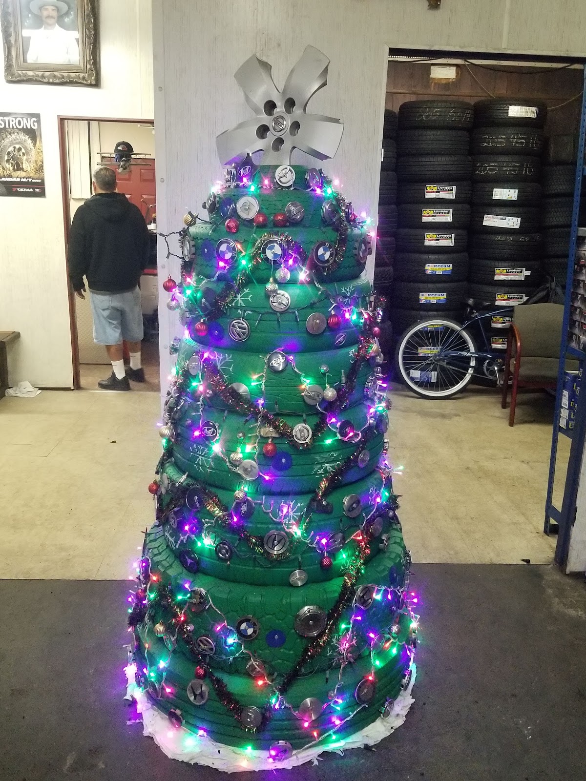 Inside Pedro and Son's, stacked tire racks and a shop that runs on character